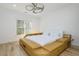 Contemporary bedroom showcasing a unique platform bed with built-in storage, complemented by a modern ceiling fan at 2461 Oak Grove Ne Ests, Atlanta, GA 30345