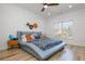 Bright bedroom featuring a colorful bed with a cushioned headboard and vibrant decor, illuminated by natural light at 2461 Oak Grove Ne Ests, Atlanta, GA 30345