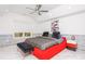 Modern bedroom with red accents, stone-like wall, and lots of light at 2461 Oak Grove Ne Ests, Atlanta, GA 30345