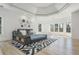 Spacious bedroom with a unique tray ceiling, patterned area rug, and large windows offering ample natural light at 2461 Oak Grove Ne Ests, Atlanta, GA 30345