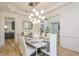 Dining room view showcasing elegant decor and seamless flow to kitchen area at 2461 Oak Grove Ne Ests, Atlanta, GA 30345