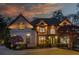 Stunning brick home featuring manicured landscaping, arched windows, and a warm inviting entrance at 2461 Oak Grove Ne Ests, Atlanta, GA 30345