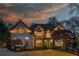 Beautiful brick home with manicured lawn and professional landscaping is showcased at dusk at 2461 Oak Grove Ne Ests, Atlanta, GA 30345