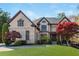 Charming two-story brick home with manicured lawn and mature trees at 2461 Oak Grove Ne Ests, Atlanta, GA 30345
