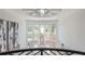 Bright and airy foyer with a modern chandelier and large windows showcasing the natural surroundings at 2461 Oak Grove Ne Ests, Atlanta, GA 30345