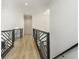 Hallway with hardwood flooring and decorative railing at 2461 Oak Grove Ne Ests, Atlanta, GA 30345