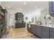 Spacious kitchen with stainless steel appliances, stone counters, an undermount sink, and custom gray cabinets at 2461 Oak Grove Ne Ests, Atlanta, GA 30345