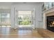 Bright living room features hardwood floors, French doors to a sunroom, and a fireplace at 2461 Oak Grove Ne Ests, Atlanta, GA 30345