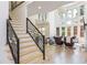 Bright living room with hardwood floors, staircase and large windows offering natural light at 2461 Oak Grove Ne Ests, Atlanta, GA 30345