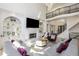 Elegant living room with fireplace, built-in shelving, modern lighting, and balcony at 2461 Oak Grove Ne Ests, Atlanta, GA 30345