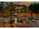 Stunning backyard pool with stone features, palm trees, and luxurious lounge area, perfect for outdoor relaxation at 2461 Oak Grove Ne Ests, Atlanta, GA 30345