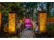 Water feature with decorative stone columns and steps, creating a vibrant outdoor space with colored lighting at 2461 Oak Grove Ne Ests, Atlanta, GA 30345