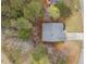 A bird's-eye view reveals the house nestled in a serene wooded area with a well-maintained lawn at 57 Sorghum Ct, Dallas, GA 30157