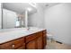 Bathroom features a cherry wood vanity, a large mirror and a combined shower and tub at 57 Sorghum Ct, Dallas, GA 30157