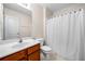 Cozy bathroom featuring a combination shower and tub and a wooden vanity at 57 Sorghum Ct, Dallas, GA 30157