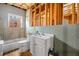 An unfinished bathroom featuring a toilet, sink with vanity, and tub with wood framing around with visible utilities at 57 Sorghum Ct, Dallas, GA 30157