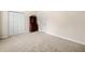 Bedroom with closet, adjacent door, and an antique cabinet at 57 Sorghum Ct, Dallas, GA 30157