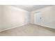 Bedroom with door, closet, neutral walls, and plush carpeting at 57 Sorghum Ct, Dallas, GA 30157