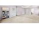 Spacious main bedroom featuring a bookshelf, neutral carpeting, and ample natural light at 57 Sorghum Ct, Dallas, GA 30157