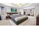 Spacious main bedroom with tray ceilings, large windows, and plush carpeting for ultimate comfort at 57 Sorghum Ct, Dallas, GA 30157