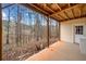 Covered patio area with views of surrounding trees and nature with doorway access to interior at 57 Sorghum Ct, Dallas, GA 30157