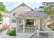 Covered backyard patio featuring outdoor seating with a beautifully landscaped backyard at 891 Glenbrook Nw Dr, Atlanta, GA 30318