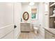 Charming bathroom with custom tile flooring, stylish vanity, and a large mirror, complemented by natural light at 891 Glenbrook Nw Dr, Atlanta, GA 30318