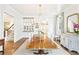Dining room featuring hardwood floors, chandelier, with built-in china cabinet in the background at 891 Glenbrook Nw Dr, Atlanta, GA 30318