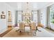 Formal dining room with a large chandelier, hardwood floors, and elegant decor at 891 Glenbrook Nw Dr, Atlanta, GA 30318