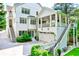 Stunning home exterior with a multi-level deck, garage, and backyard area, blending elegance with outdoor living at 891 Glenbrook Nw Dr, Atlanta, GA 30318