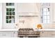 Close-up of the kitchen featuring a stainless steel range and custom cabinetry at 891 Glenbrook Nw Dr, Atlanta, GA 30318