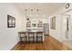 Kitchenette features floating shelves, stainless steel appliances, pendant lights and adjacent bathroom at 891 Glenbrook Nw Dr, Atlanta, GA 30318