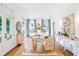 Bright and airy living room with hardwood floors, neutral decor, and French doors leading to the outdoors at 891 Glenbrook Nw Dr, Atlanta, GA 30318
