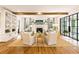 Well-lit living room featuring a fireplace, built-in shelving, and large windows for natural light at 891 Glenbrook Nw Dr, Atlanta, GA 30318