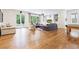 Living room with hardwood floors, built-in shelving, lots of light, and view to the backyard at 891 Glenbrook Nw Dr, Atlanta, GA 30318