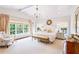 Serene main bedroom with vaulted ceilings, many windows, and elegant furnishings at 891 Glenbrook Nw Dr, Atlanta, GA 30318