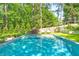 Inviting pool and spa area surrounded by manicured lawns, mature trees, and ample space for lounging and relaxation at 891 Glenbrook Nw Dr, Atlanta, GA 30318