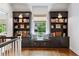 Cozy reading nook with built-in bookshelves, a window seat, and hardwood floors at 891 Glenbrook Nw Dr, Atlanta, GA 30318