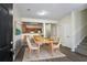 Cozy dining area with light wood floors and a view of the kitchen at 11352 Michelle Way, Hampton, GA 30228