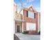 Charming brick townhouse with a welcoming front entrance and neat landscaping at 11352 Michelle Way, Hampton, GA 30228