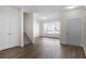 Inviting living room with hardwood floors, a staircase, and a bright window for ample light at 11352 Michelle Way, Hampton, GA 30228