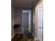 The hallway features updated paint and flooring and offers seamless transition between rooms at 1290 Elizabeth Ave, Atlanta, GA 30310