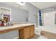 Full bathroom featuring a tub-shower combo, extended vanity, and tiled floors at 411 Sureyya Dr, Canton, GA 30114