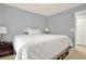 Comfortable secondary bedroom with carpet flooring, neutral walls and a double door closet at 411 Sureyya Dr, Canton, GA 30114