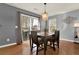 Bright dining area with hardwood floors, a sliding glass door, and modern decor at 411 Sureyya Dr, Canton, GA 30114