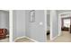 Open hallway with view into rooms, and a decorative wall art at 411 Sureyya Dr, Canton, GA 30114