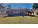 Backyard featuring a grassy lawn, deck and staircase at 4152 Berkshire Ct, Villa Rica, GA 30180