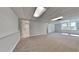 A finished basement featuring neutral carpet and an entrance to another room at 4152 Berkshire Ct, Villa Rica, GA 30180