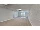 A finished basement featuring neutral carpet and an entrance to another room at 4152 Berkshire Ct, Villa Rica, GA 30180