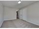 A cozy bedroom featuring neutral carpet, a closet, and a neutral paint at 4152 Berkshire Ct, Villa Rica, GA 30180